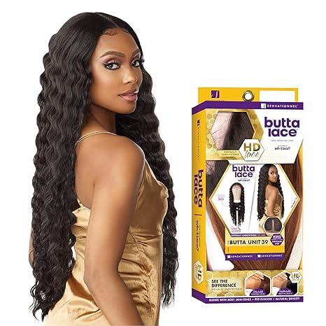 Woman wearing long, wavy human hair wig with Butta Lace HD lace front packaging beside her