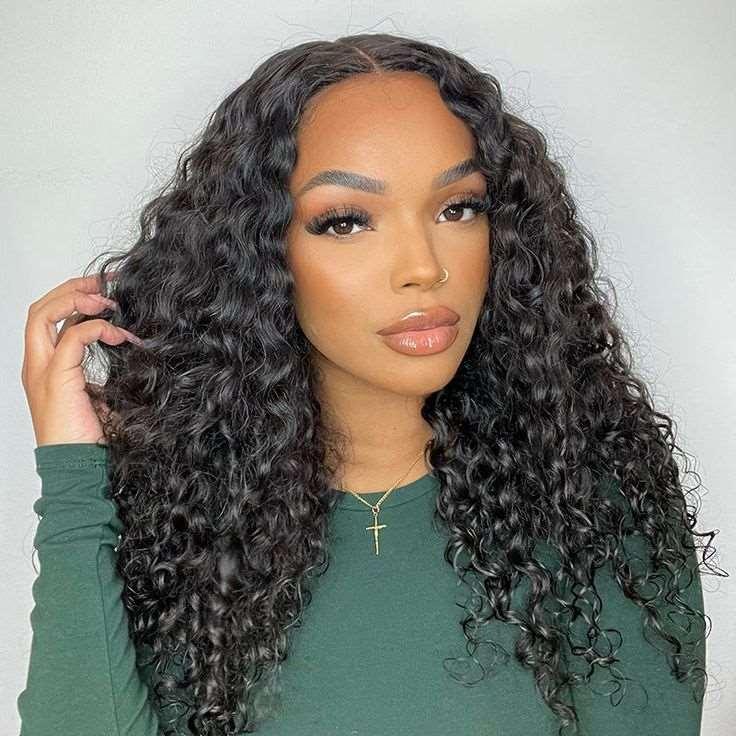 Woman wearing voluminous curly human hair wig with natural-looking lace front, styled for everyday elegance.