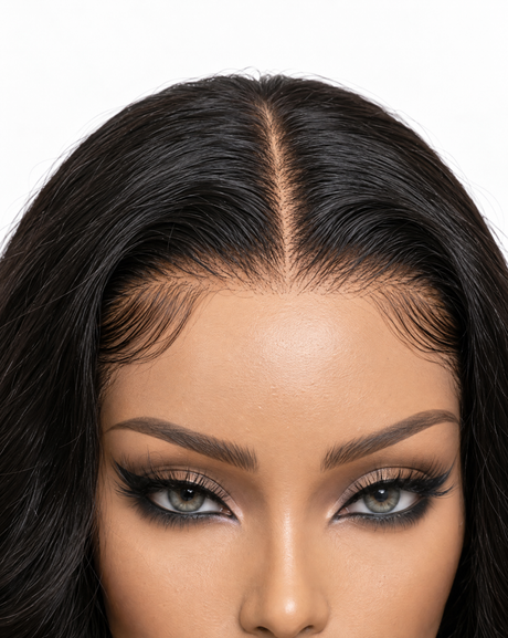 A close-up of a lace front wig with a clean center part and hairlines.
