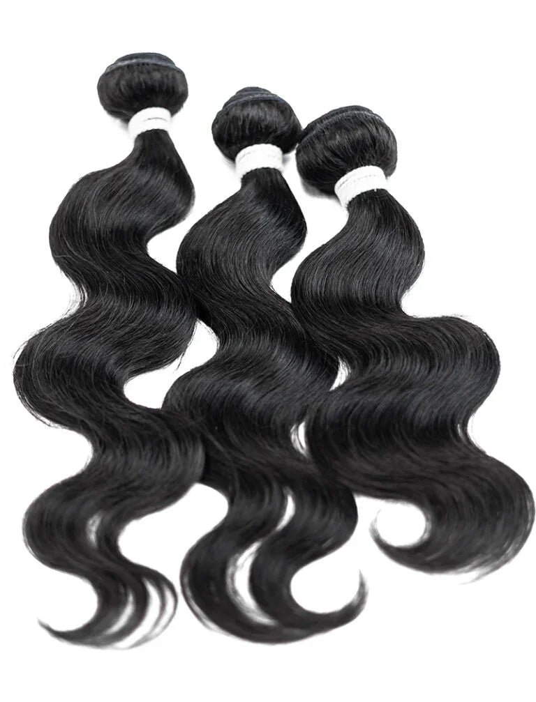 Three bundles of natural black body wave human hair extensions for styling