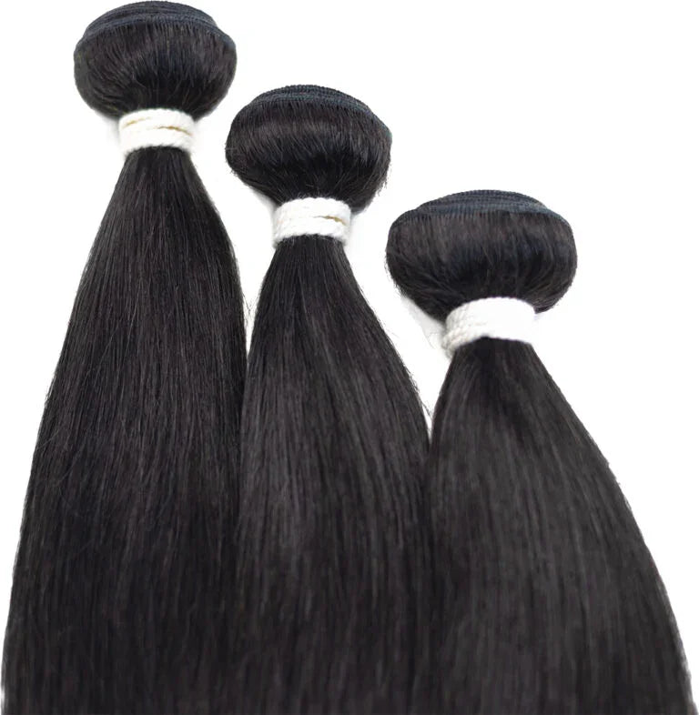 Three bundles of straight human hair extensions, sleek and natural for styling