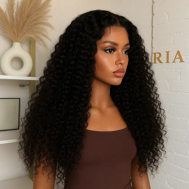 Woman wearing long, curly human hair wig with natural voluminous waves, styled for everyday elegance.