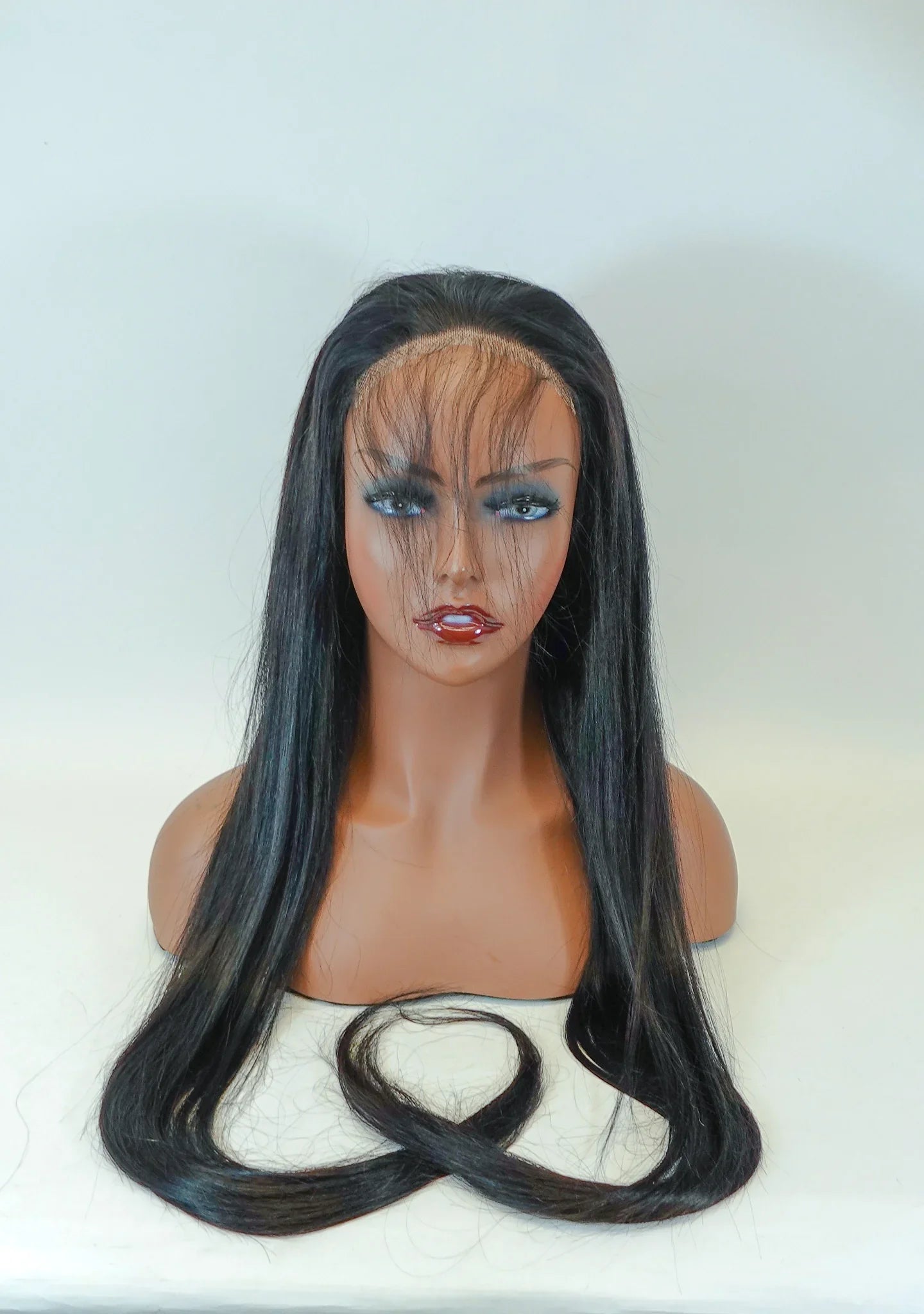 Long straight human hair wig with lace front on mannequin, natural styling ready