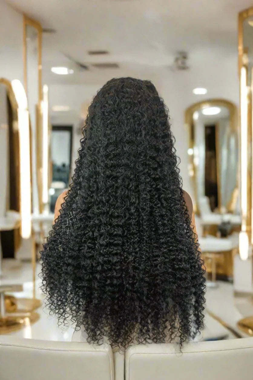 Long curly human hair wig in luxury salon setting, natural voluminous curls for styling