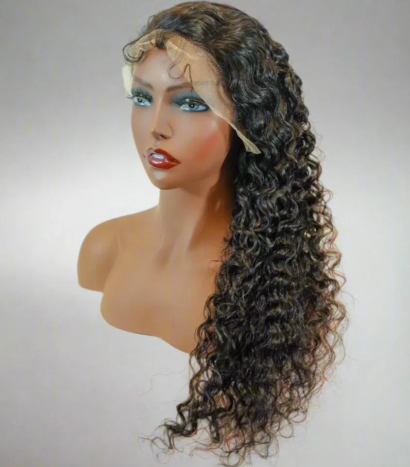 Long curly human hair wig with lace front on mannequin, natural styling ready