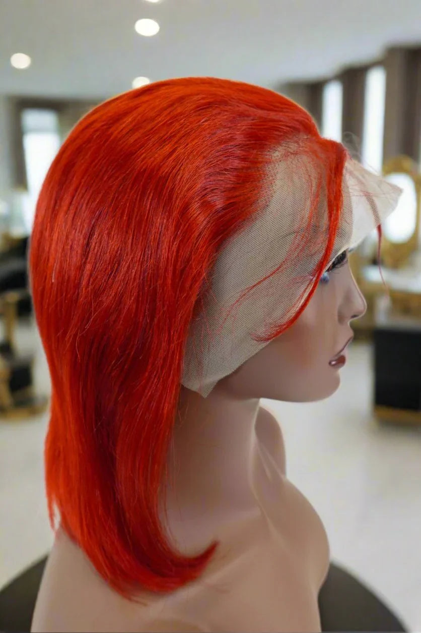 Vibrant red human hair wig with lace front on mannequin, natural styling ready