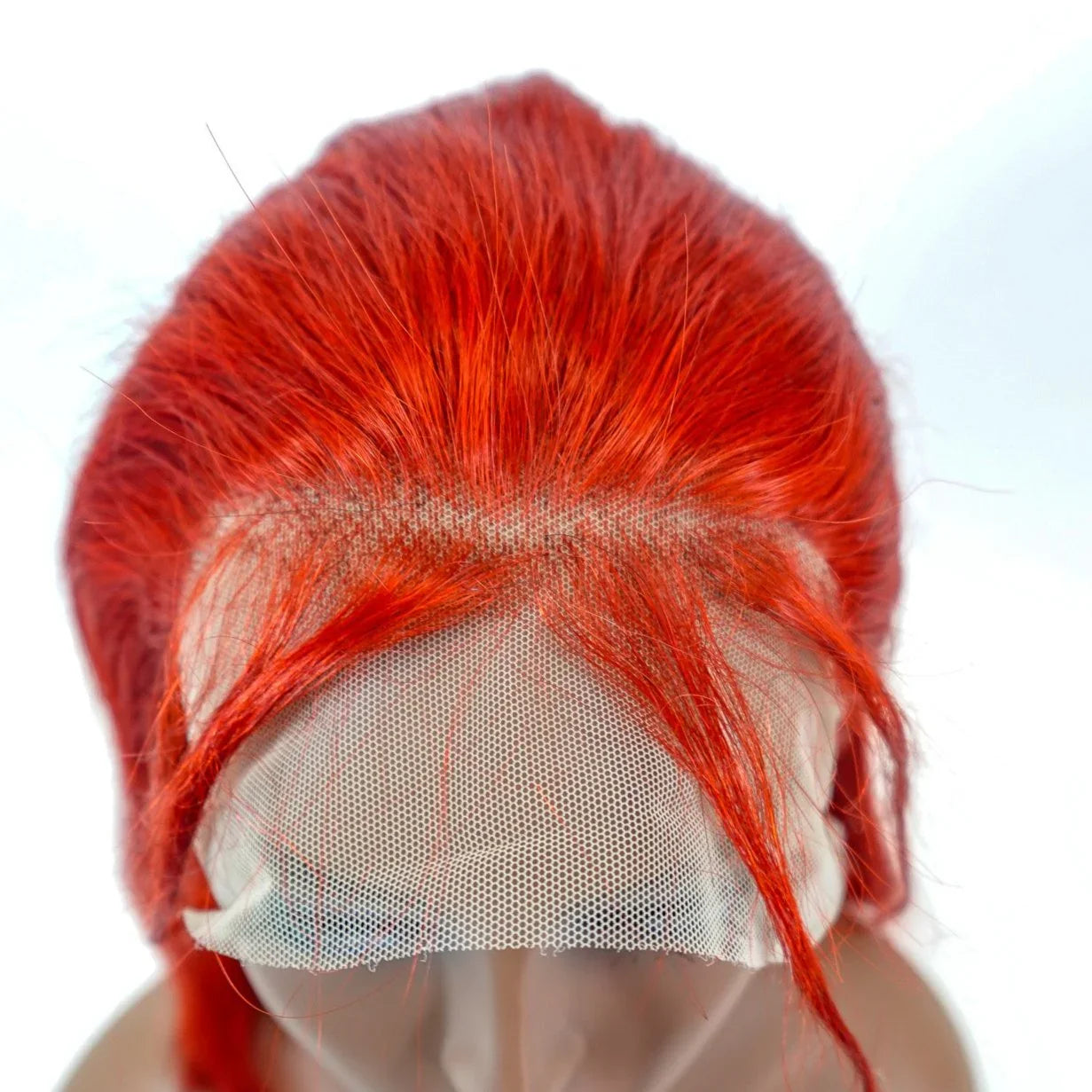 Vibrant red human hair lace front wig with natural-looking scalp mesh, perfect for seamless styling.