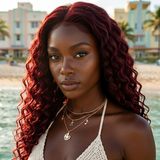 black woman wearing Deep Wave 15A Transparent 13x4 Full Frontal 180 Density Dark Burgundy/99J