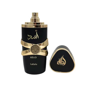 Luxury black and gold ASAD perfume bottle with Lattafa branding, elegant design for premium fragrance