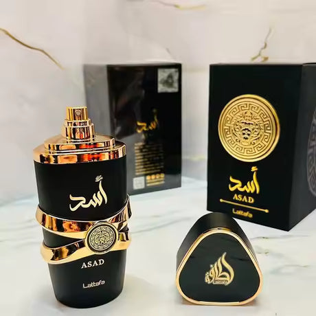 Luxury black and gold Asad perfume bottle with matching box and cap, elegant fragrance design