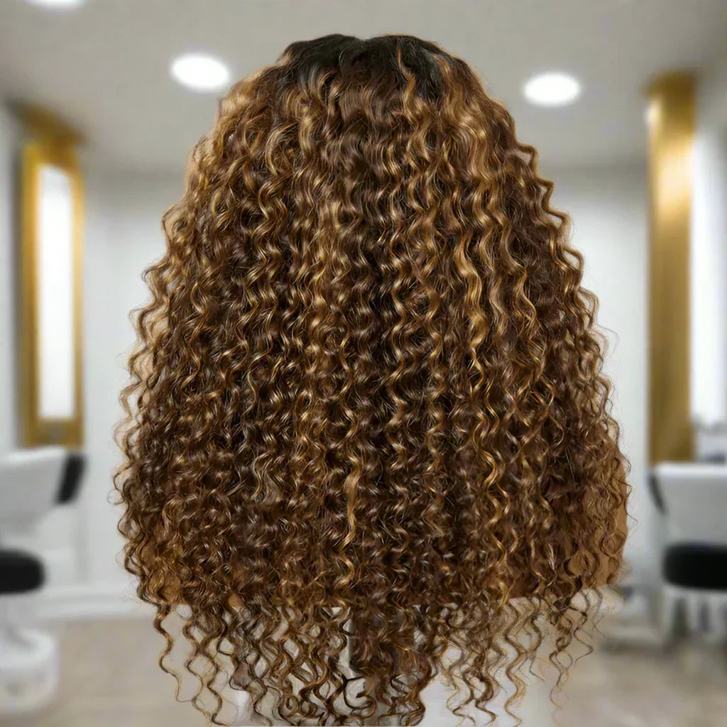 Luxury human hair wig with voluminous caramel curls, salon-styled for natural, bouncy texture