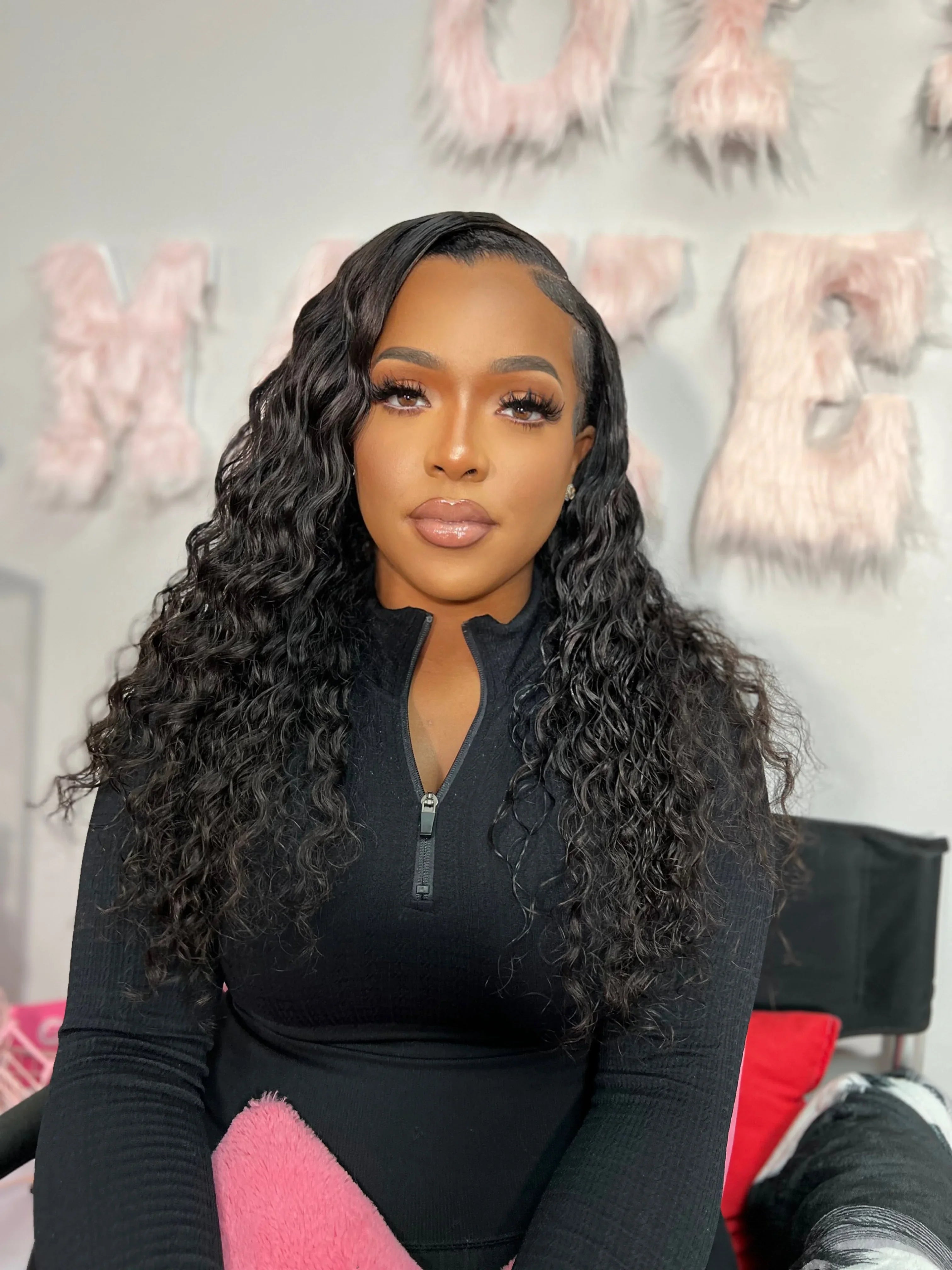 Woman with long curly human hair wig, styled naturally for beauty essentials