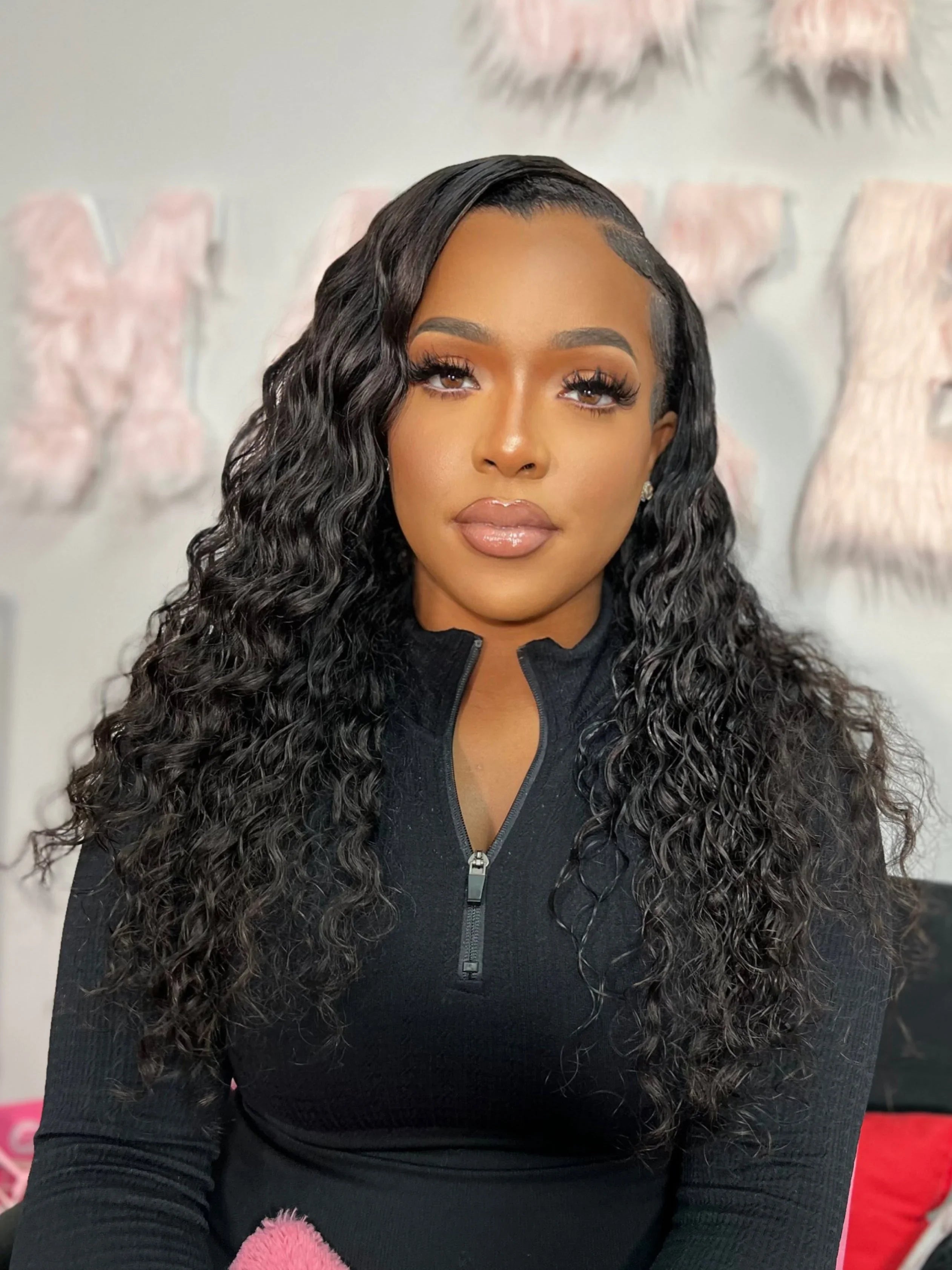 Woman wearing a natural-looking human hair wig with deep waves, styled for everyday elegance.