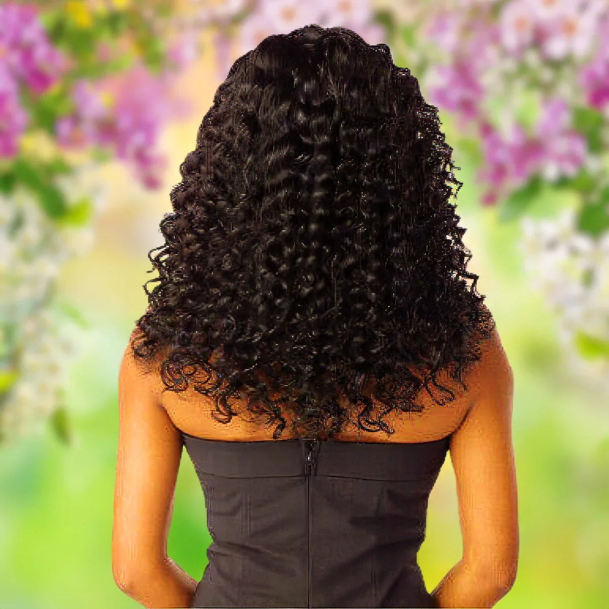 Woman with voluminous curly black human hair wig, back view, floral background