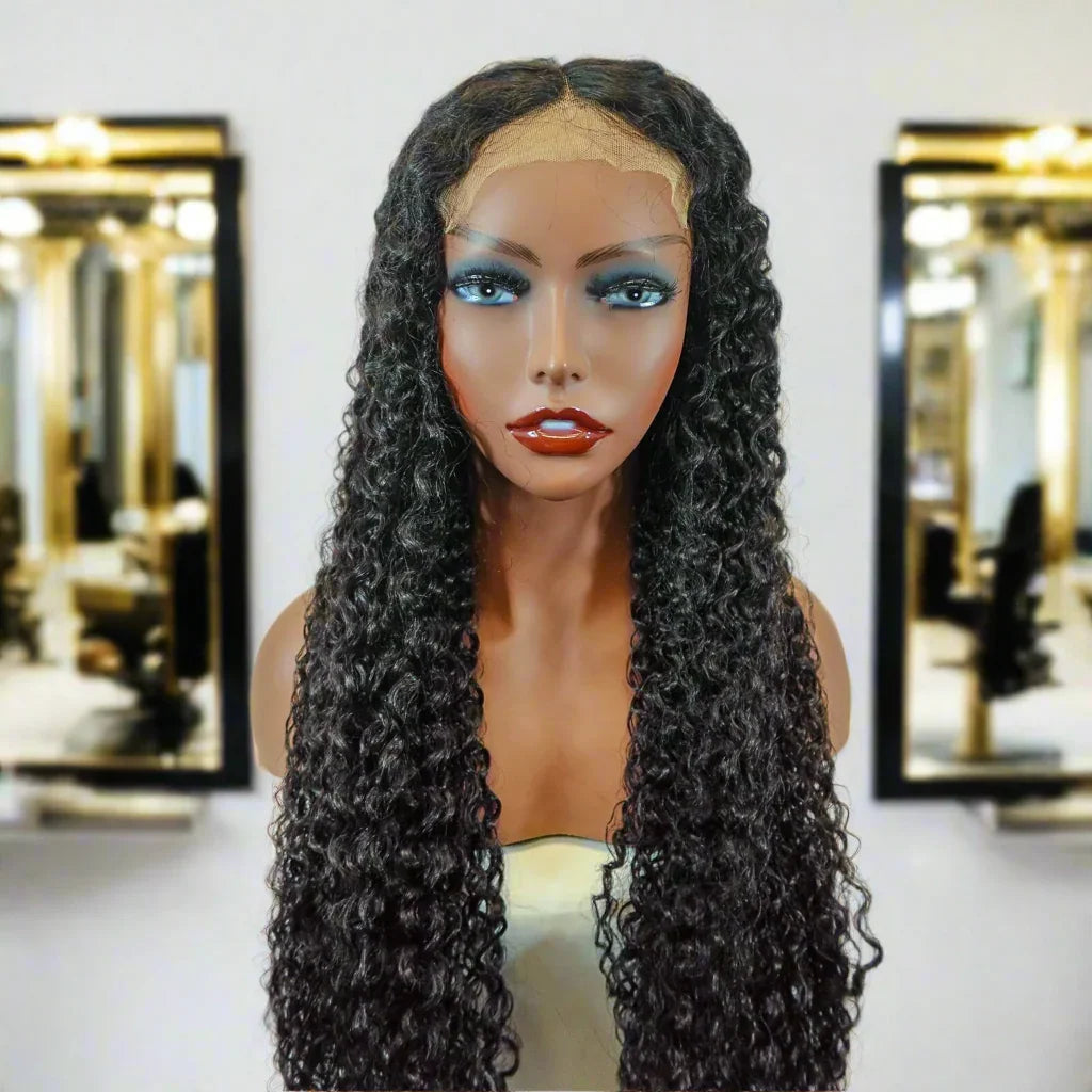 Long curly human hair wig with lace front on mannequin, salon mirror background