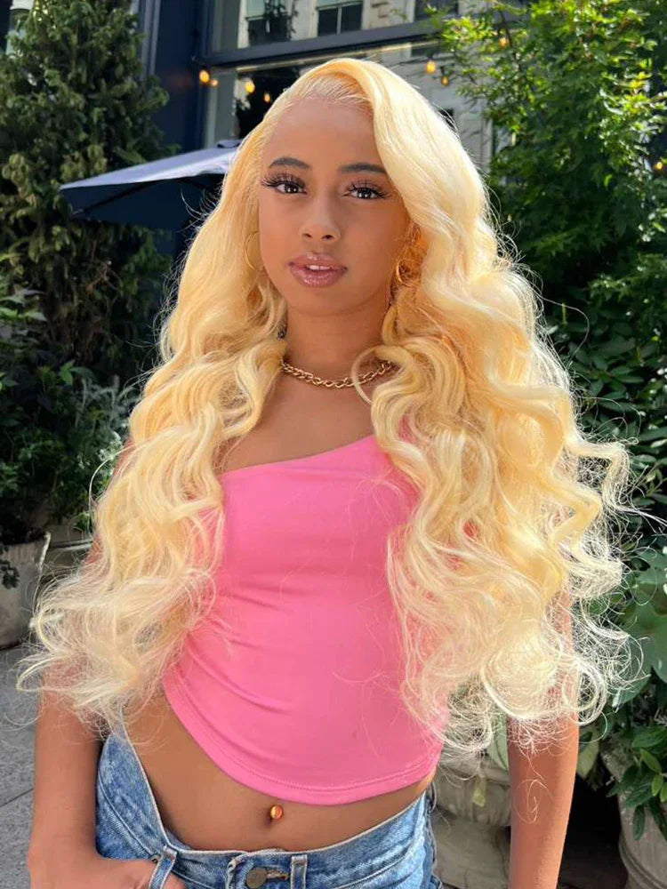 Blonde human hair wig with voluminous curls, styled for natural, glamorous look