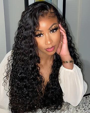 Woman wearing voluminous curly human hair wig with lace front, styled for natural look