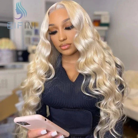 Blonde human hair wig with voluminous waves, styled for natural look and everyday wear