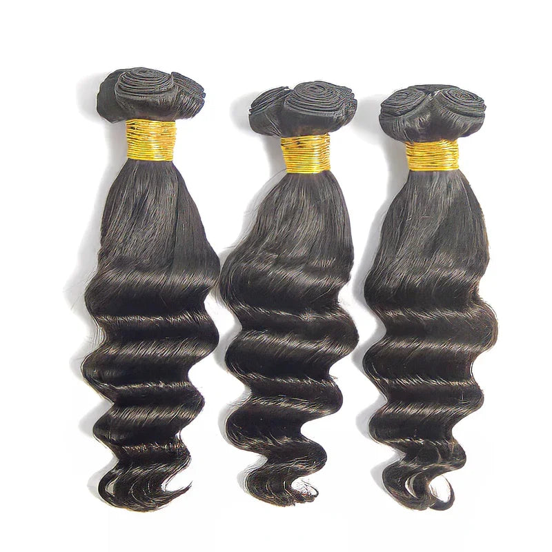 Three bundles of natural body wave human hair with gold bands, ideal for styling and extensions.
